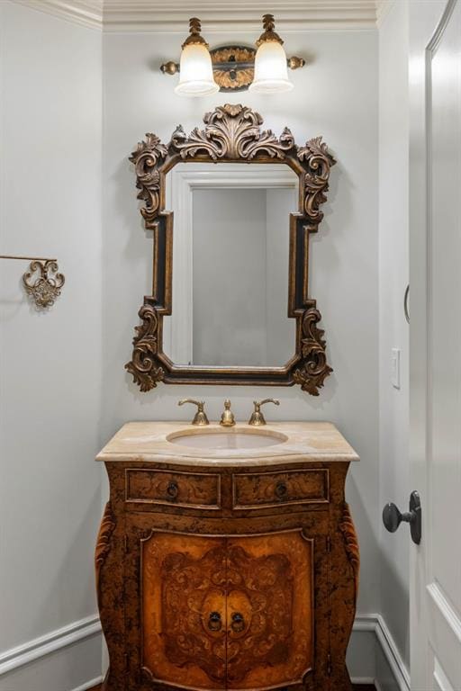 bathroom featuring vanity and crown molding