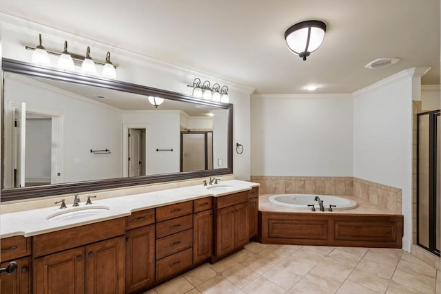 bathroom with tile patterned flooring, vanity, ornamental molding, and independent shower and bath