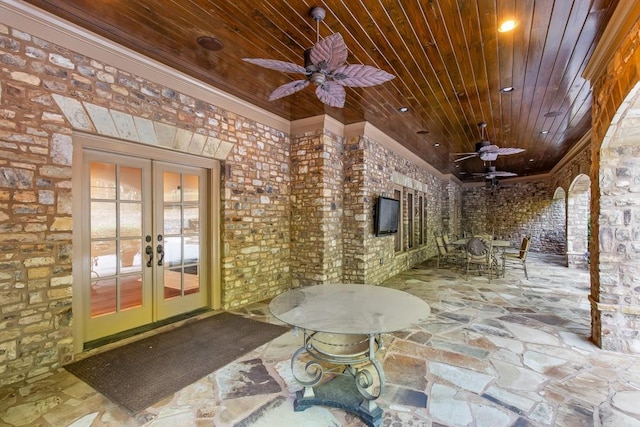 view of patio featuring ceiling fan and french doors