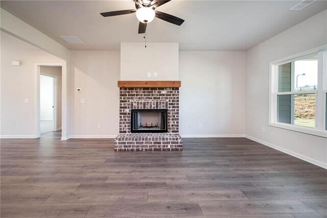 106 Harmony Farms Orch, Eatonton, GA 31024 - unfurnished living room with ceiling fan, a fireplace, and hardwood / wood-style flooring