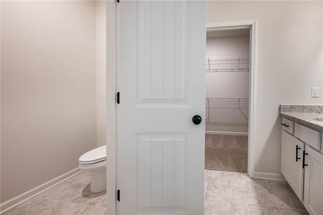 106 Harmony Farms Orch, Eatonton, GA 31024 - bathroom with tile patterned floors, vanity, and toilet