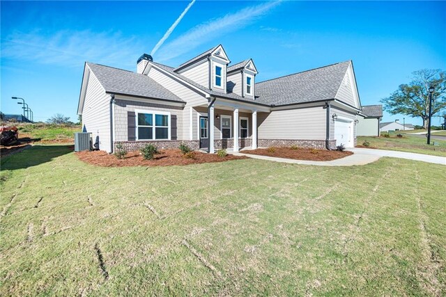 106 Harmony Farms Orch, Eatonton, GA 31024 - view of front of property featuring central AC unit, a garage, and a front yard