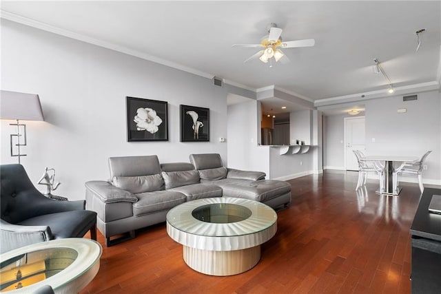 living room featuring visible vents, ornamental molding, a ceiling fan, and wood finished floors