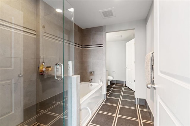full bathroom featuring a bath, visible vents, a shower stall, tile patterned floors, and toilet