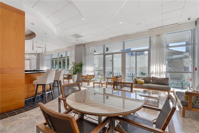 dining room with a drop ceiling