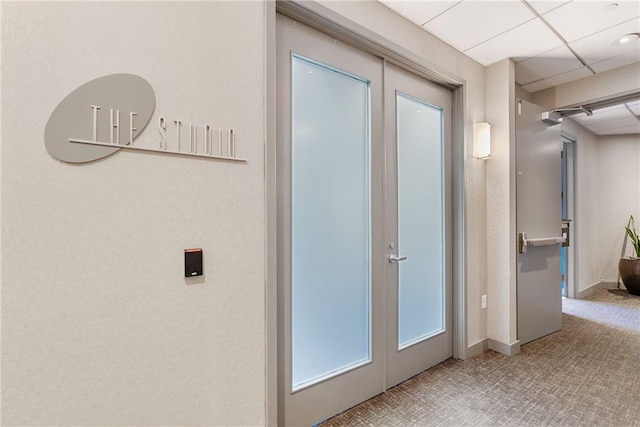 hallway featuring baseboards