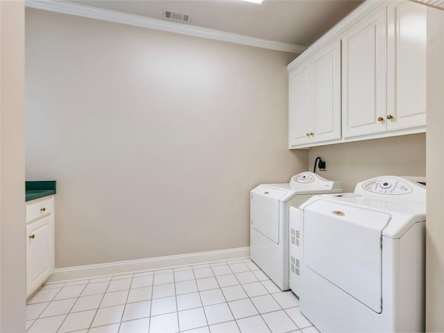 laundry room featuring ornamental molding, visible vents, baseboards, cabinet space, and washer and clothes dryer