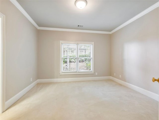 empty room with baseboards, visible vents, light colored carpet, and ornamental molding