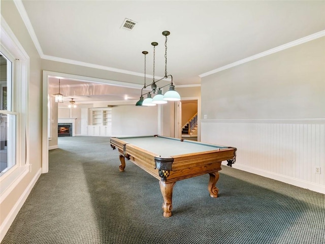 game room with visible vents, ornamental molding, carpet, billiards, and a lit fireplace