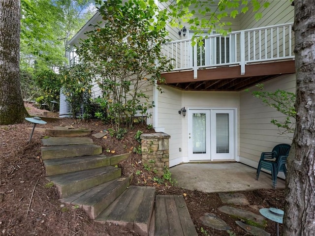 rear view of property featuring french doors and a patio