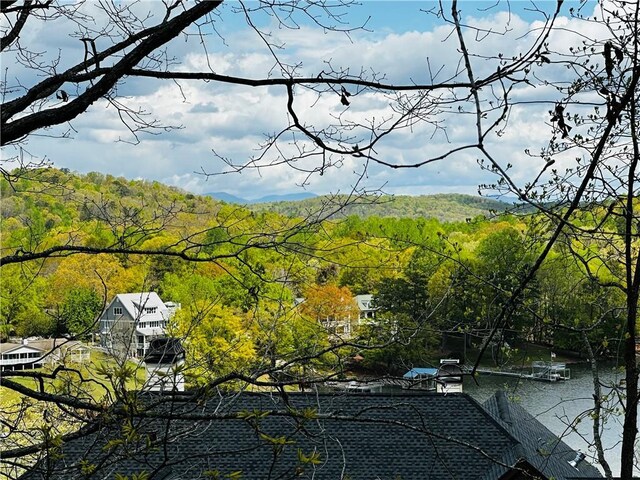 exterior space featuring a forest view