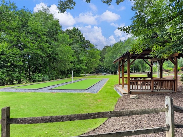 surrounding community with a gazebo and a lawn