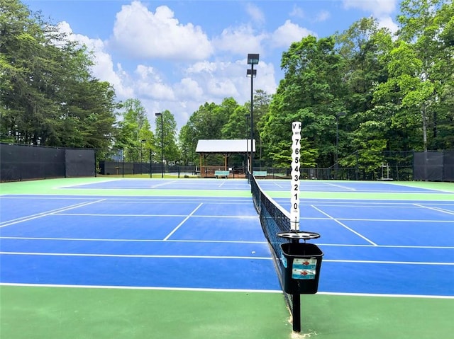 view of sport court featuring community basketball court and fence