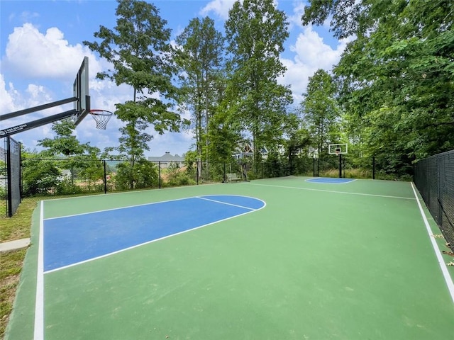 view of sport court featuring fence and community basketball court