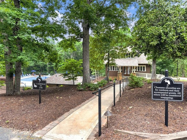 view of front of home featuring fence