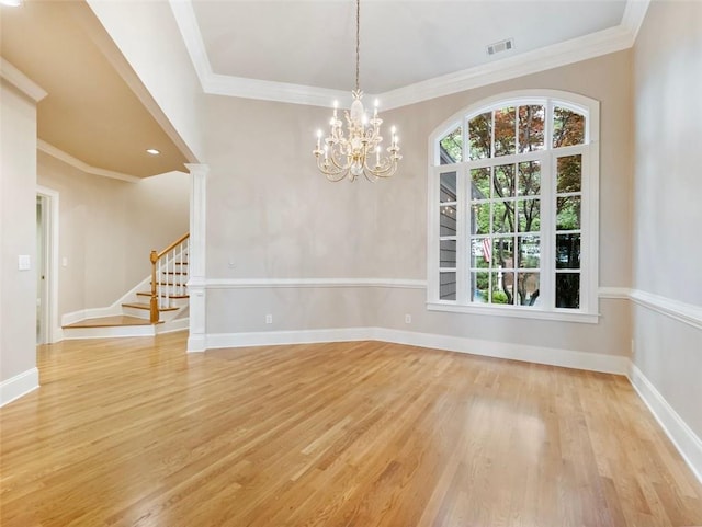 unfurnished dining area with visible vents, light wood-style flooring, a chandelier, and stairs