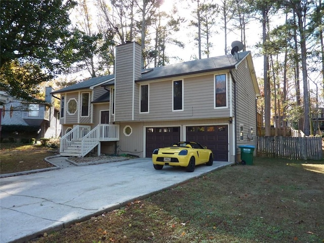 rear view of house featuring a garage