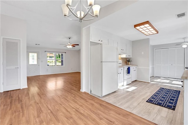 kitchen with light wood finished floors, visible vents, white appliances, and white cabinetry