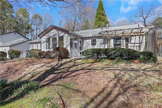 view of front of property with a pergola