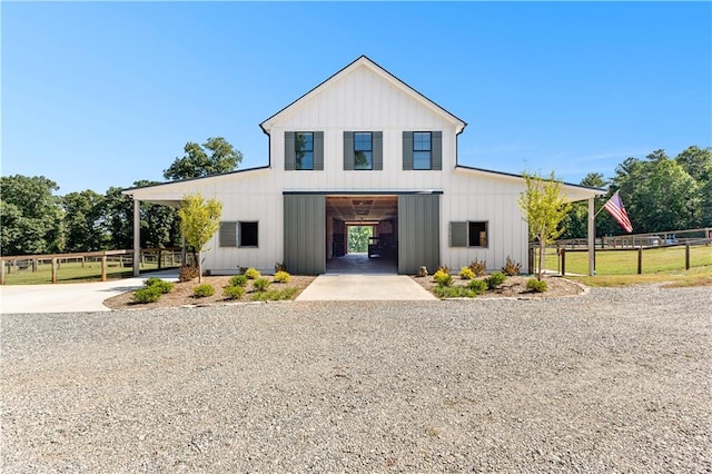 modern inspired farmhouse featuring a carport