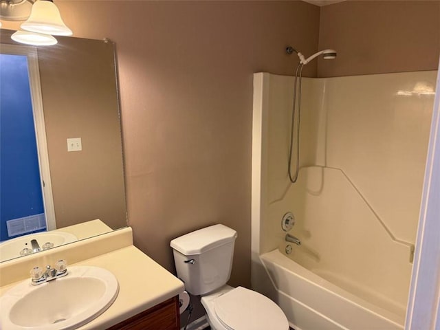 bathroom featuring visible vents, bathing tub / shower combination, toilet, and vanity