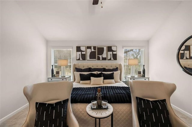 carpeted bedroom with vaulted ceiling and ceiling fan