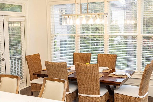 dining space with wood finished floors