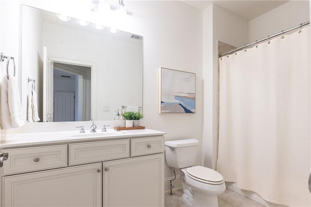 bathroom featuring visible vents, a shower with shower curtain, toilet, vanity, and tile patterned floors