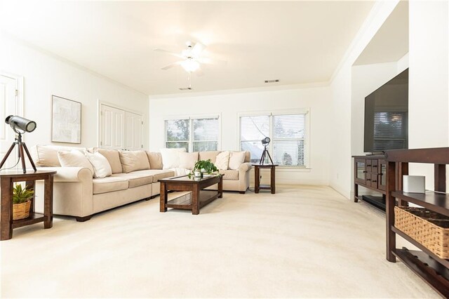 bedroom featuring light carpet, ceiling fan, and baseboards