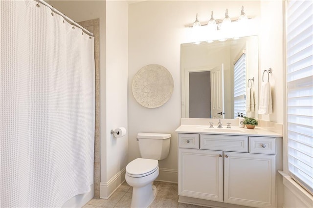 bathroom featuring a shower with curtain, vanity, baseboards, and tile patterned floors