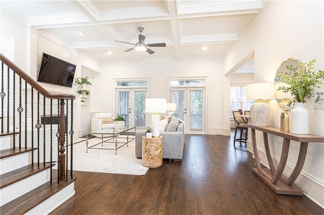 living room featuring coffered ceiling, stairway, wood finished floors, french doors, and beam ceiling