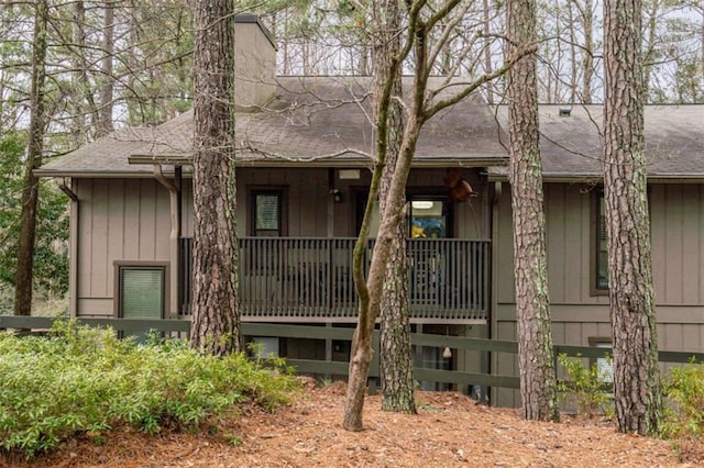 view of front of property with board and batten siding and a shingled roof