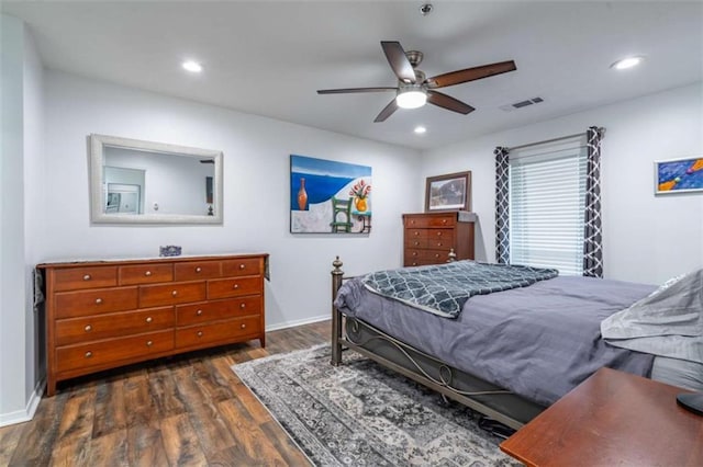 bedroom featuring recessed lighting, wood finished floors, visible vents, and baseboards