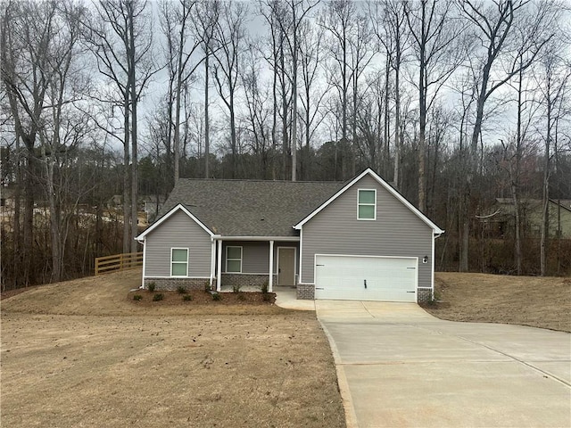 view of front facade with a garage, brick siding, a shingled roof, fence, and driveway