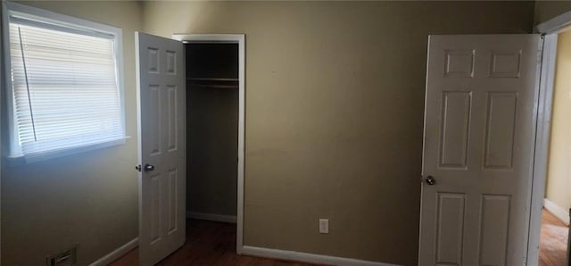 unfurnished bedroom featuring a closet