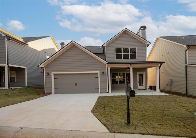 view of front of property with a garage and a front yard