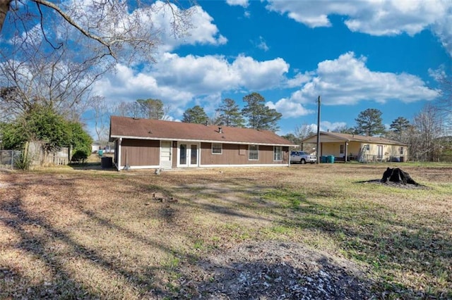 rear view of property with french doors