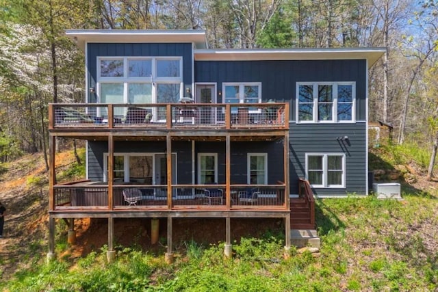 124 Nichols Branch Ln, Clayton, GA 30525 - rear view of house with a wooden deck, board and batten siding, and stairs