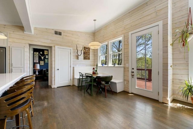 124 Nichols Branch Ln, Clayton, GA 30525 - dining room featuring dark wood-style flooring and wooden walls