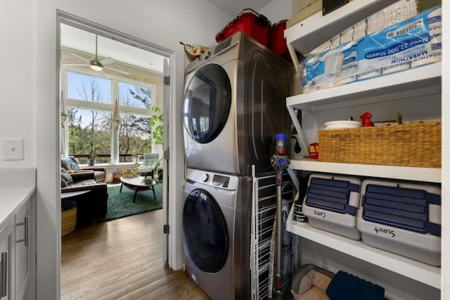 124 Nichols Branch Ln, Clayton, GA 30525 - clothes washing area featuring stacked washer / drying machine, wood finished floors, and a ceiling fan
