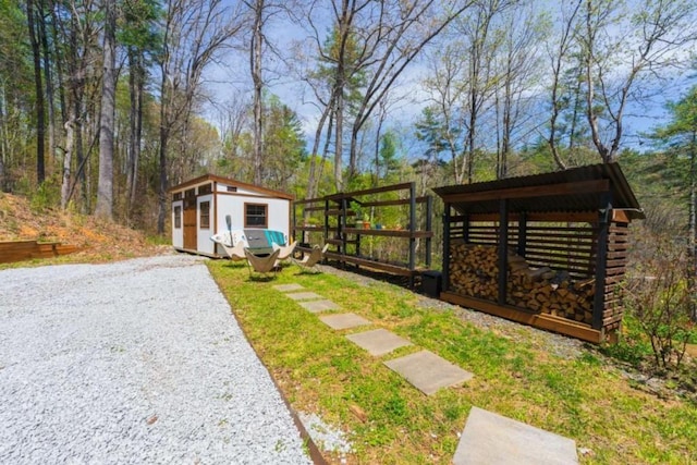 124 Nichols Branch Ln, Clayton, GA 30525 - view of yard featuring an outbuilding and a storage shed