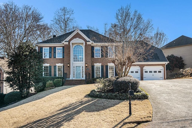 colonial inspired home with a garage