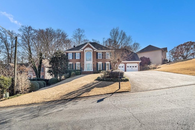 view of front of home featuring a front yard and a garage