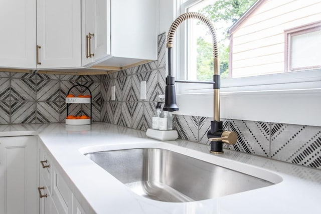 details featuring backsplash and sink