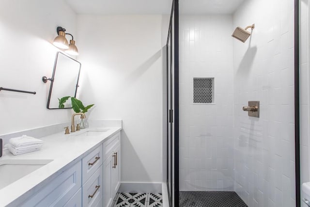 bathroom featuring walk in shower, double sink, tile floors, and large vanity