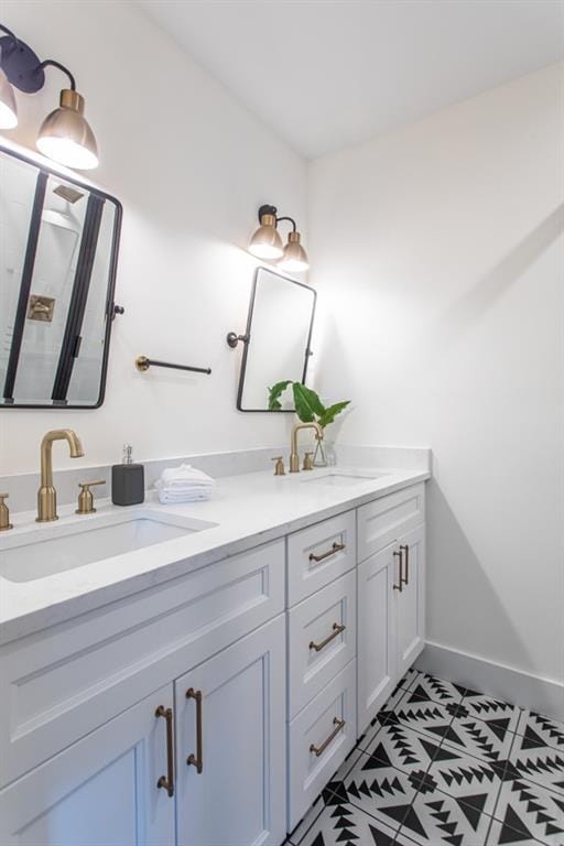 bathroom featuring double sink, tile flooring, and vanity with extensive cabinet space