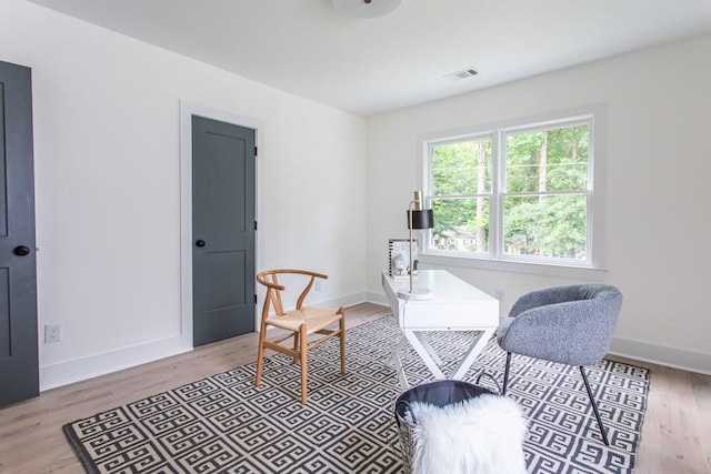 sitting room featuring light hardwood / wood-style flooring