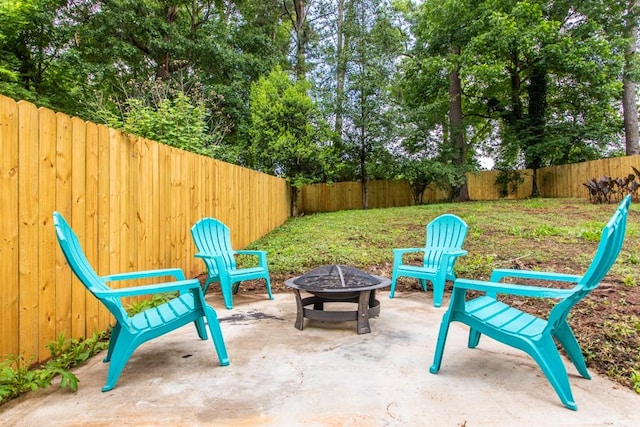 view of patio / terrace with an outdoor fire pit