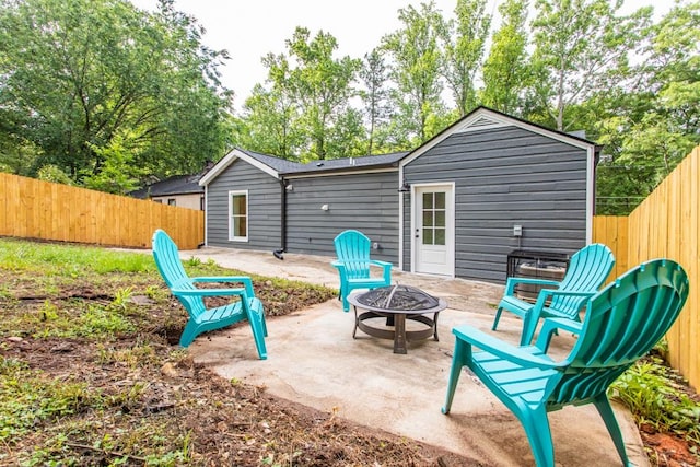 view of terrace featuring an outdoor fire pit