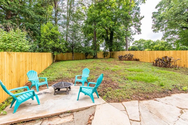 view of yard featuring a patio and an outdoor fire pit